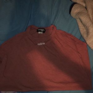 A reddish orange tank top